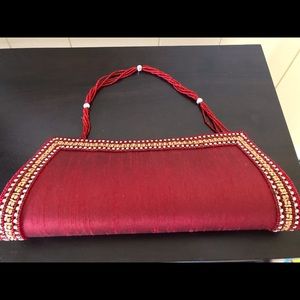 Maroon beaded handle handbag